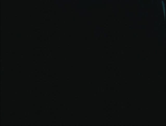 Girl in a dark room with flashing lights