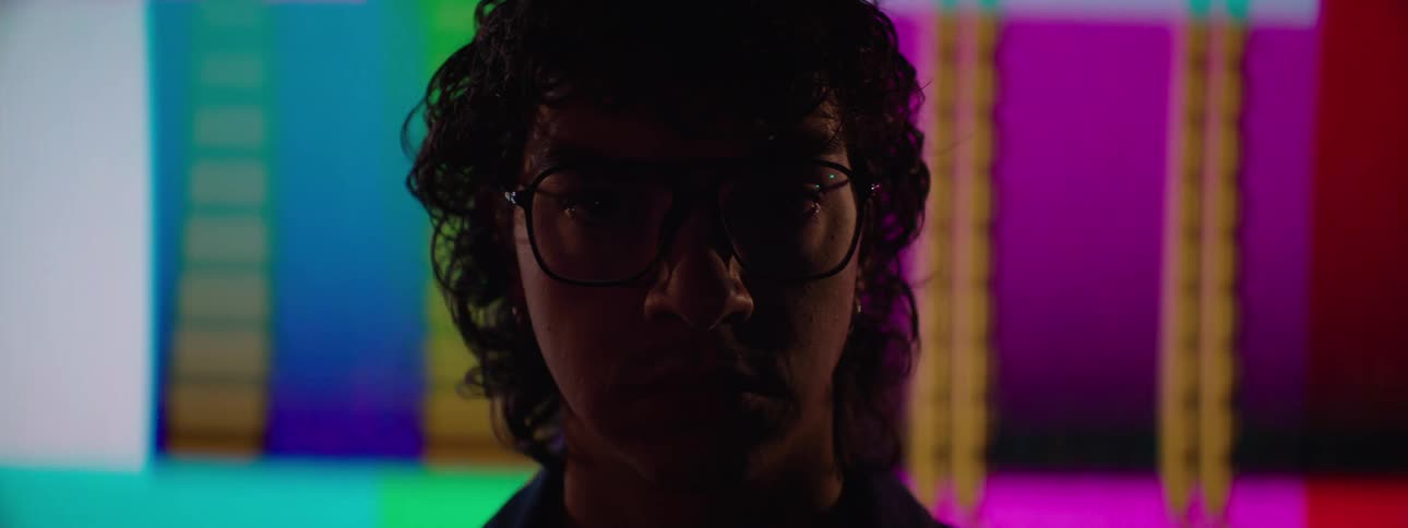 Person standing in front of video