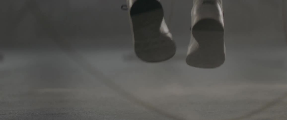 A woman jumps rope in a gym