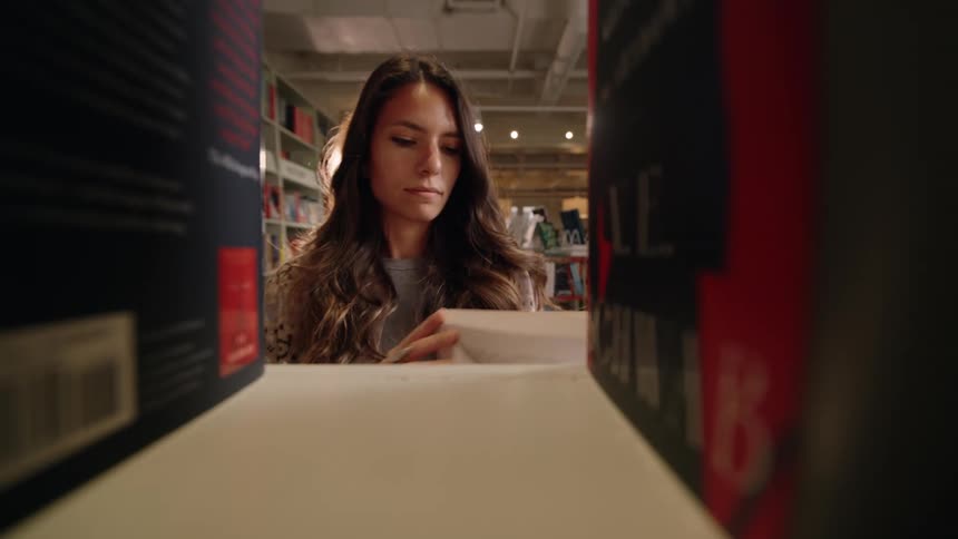 A footage of a lady arranging boxes