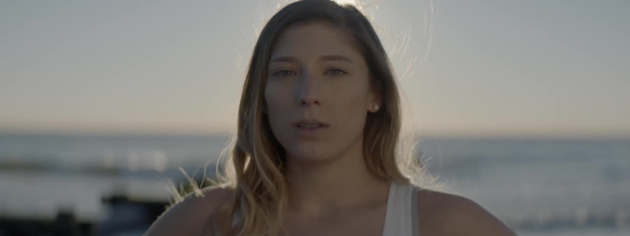 Woman standing outside in the sunlight