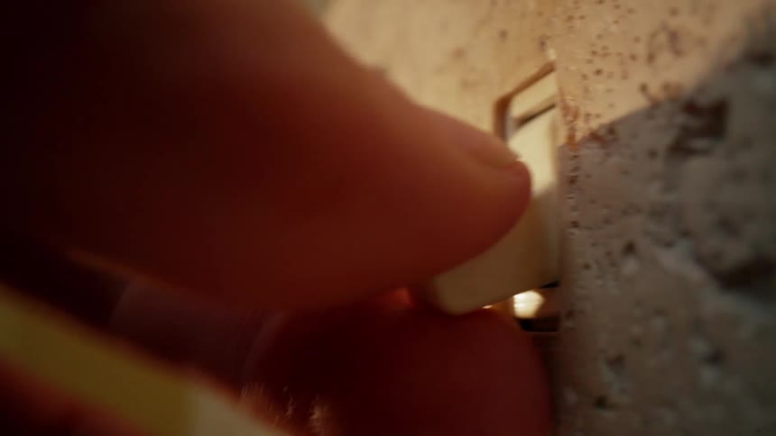 A close up clip of a person using a switch