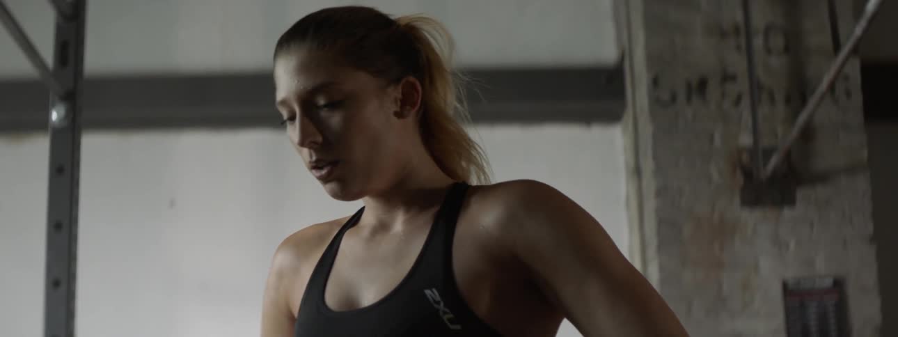 A woman exhales rapidly after exercising