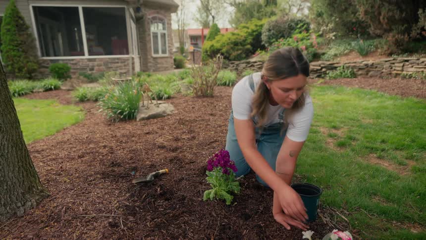 Woman in a backyard gardening