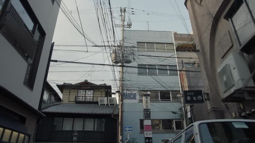 Power lines go in all directions on this street