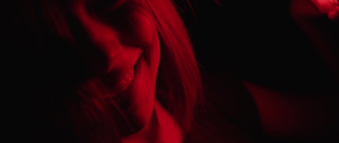 A scene of a woman's face close up and it is red