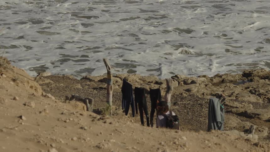 A footage of a person walking closer to the sea