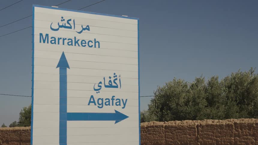 The sign gives directions on the road