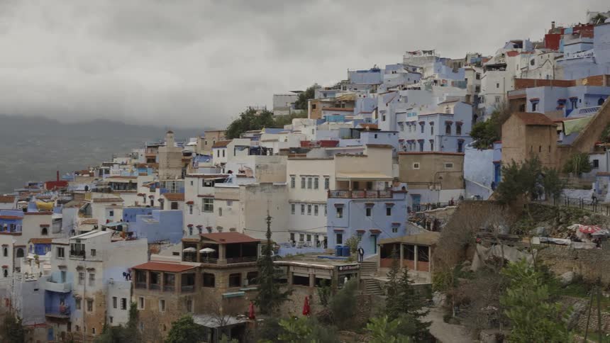 Urban city among mountains with classical architecture