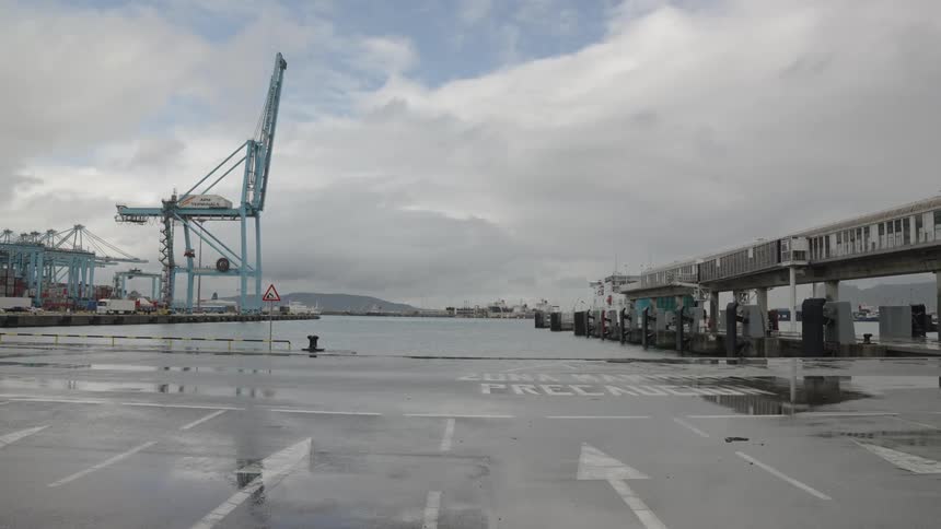 Seaport by the sea with mountains in the background