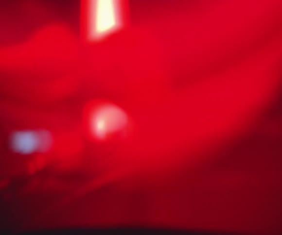Close up of DJ hand on controller performing at club