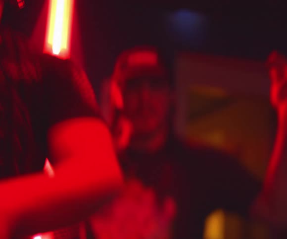 People are dancing to music in a club