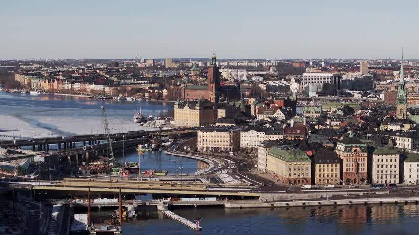 Traffic flows on the roads by the shore of the city