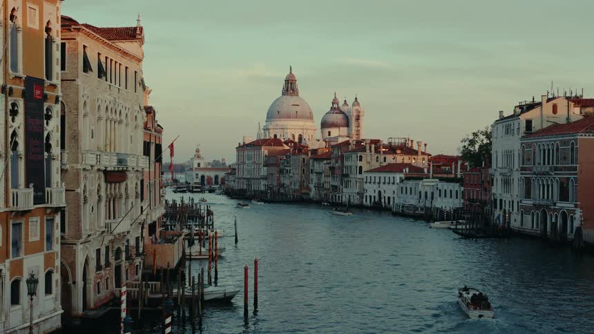 Maritime canal with boats and classical architecture houses around