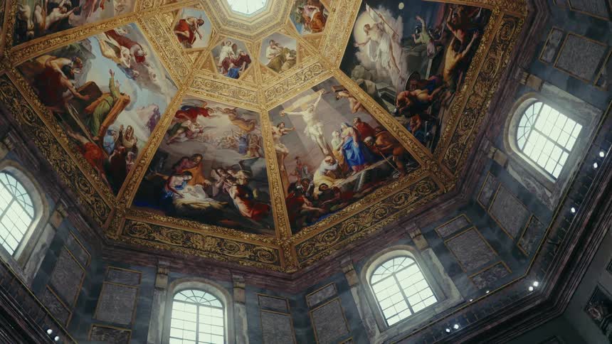 A camera orbits a historic dome ceiling showcasing vivid religious frescoes and ornate architecture