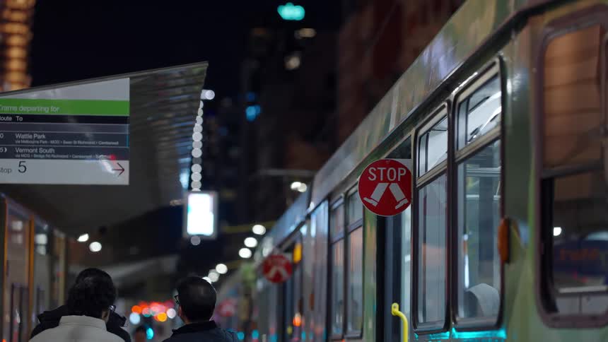 The train is stopped at the station at night