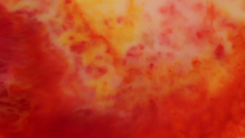 A red liquid is flowing into yellow liquid and pushing it aside