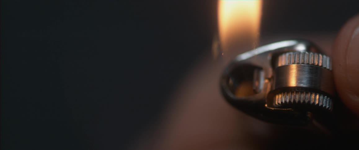 A person sparking a lighter