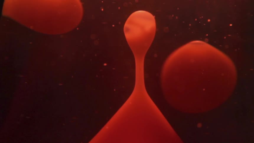 Red and orange liquid bubbles and floats