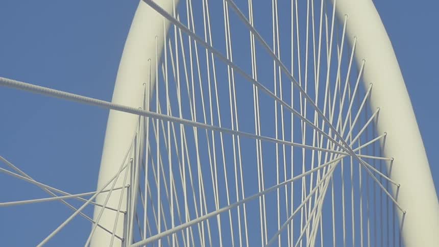 A large hoop has metal cords coming from it