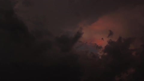 A night sky that has a reddish tint