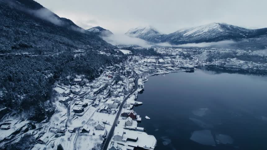 A small town is on the edge of a mountain