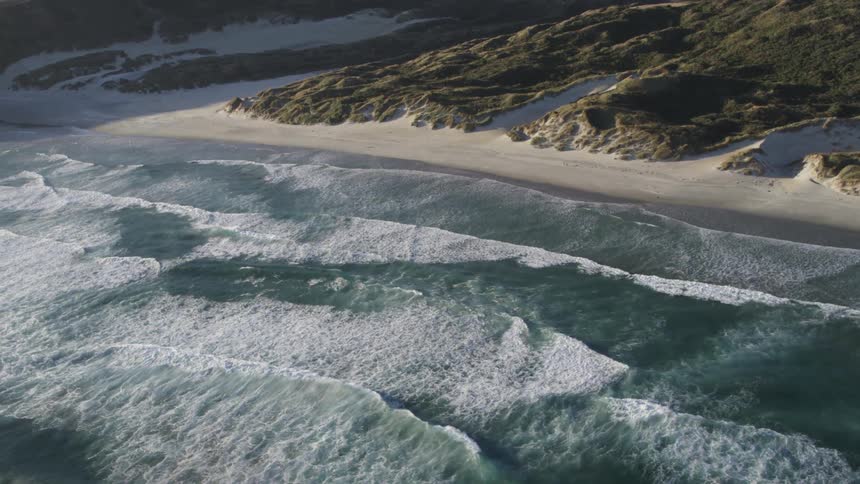 Waves crashing against the beach