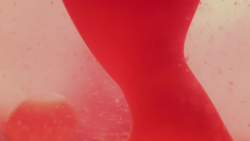 The lava lamp has red bubbles all around