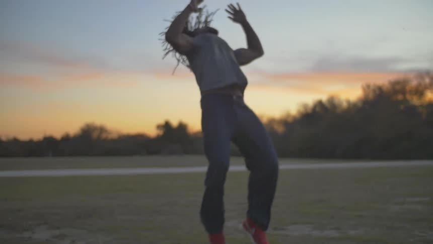 A man performs a cartwheel and a flip