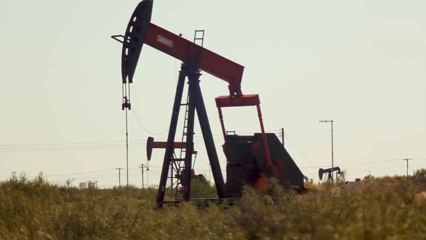 An oil machine drills in a field