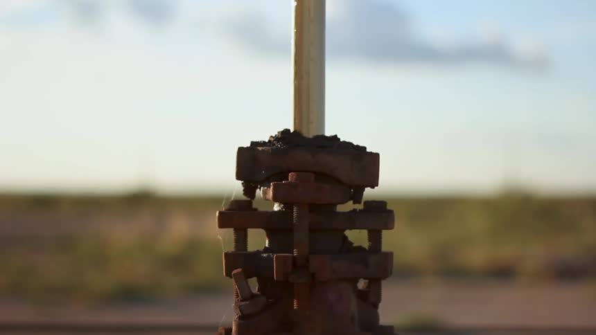 A machine is pushing a rod into the ground