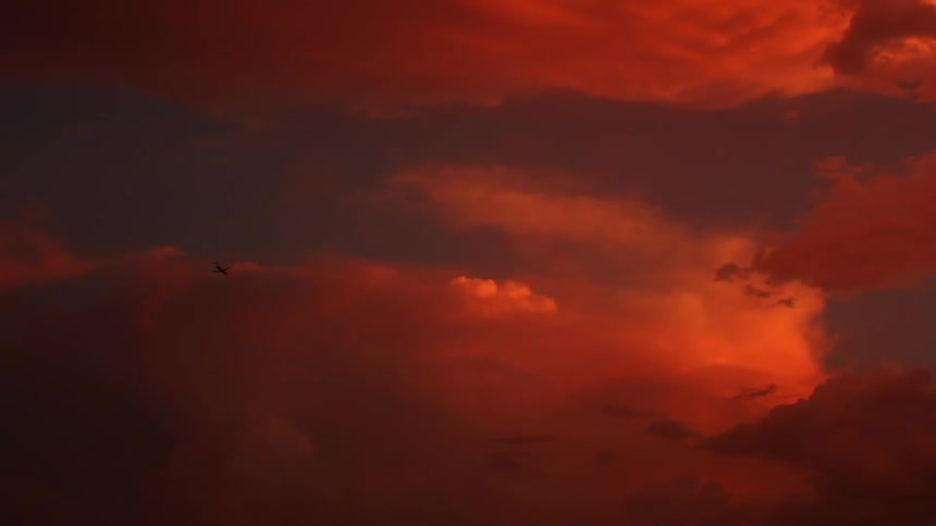 The sky is red and heavily clouded at dawn