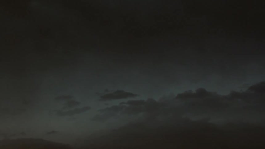 Clouds moving fast as darkness comes in
