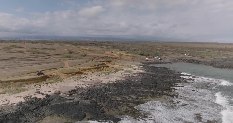 The long flat landscape leads to the ocean