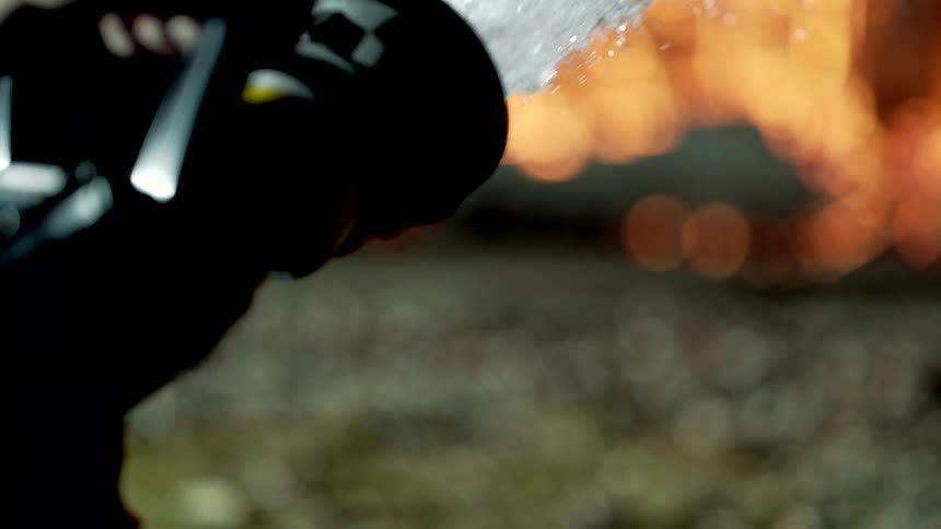 A hose being used to put out a fire