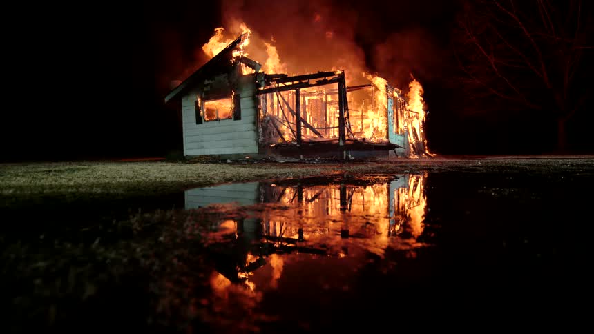 A house is engulfed flames