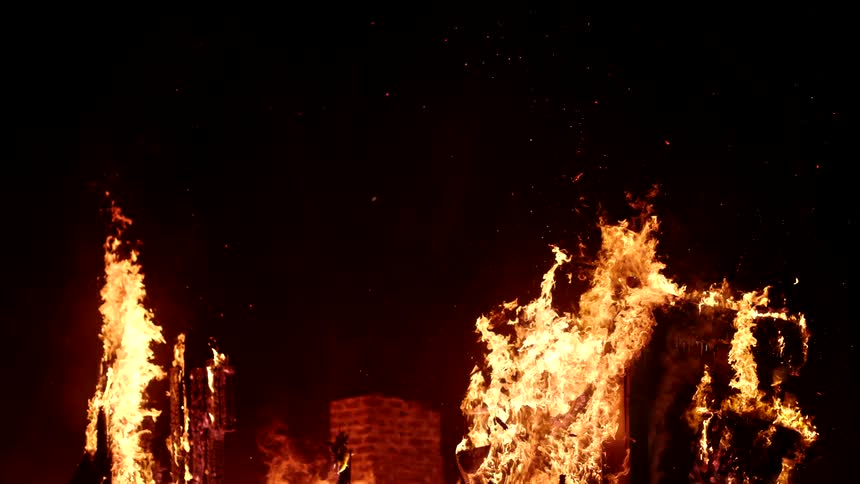 Heavy flames engulf the home burning it to the ground