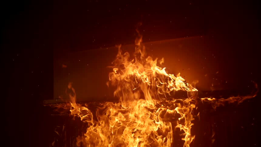 Fire covers the entire home at night