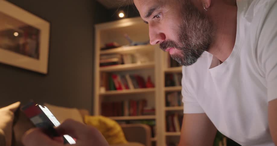 A man is texting on his cell phone