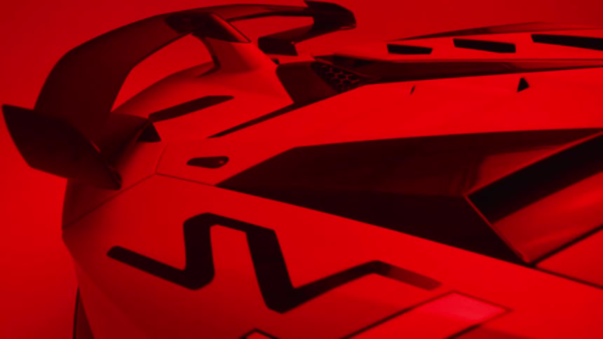 A red light flashes on the sports car in the showroom