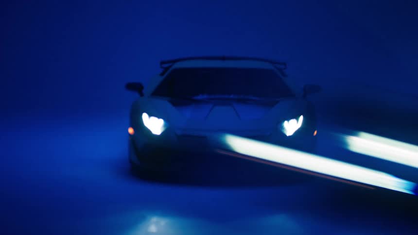 The headlights shine as the lights flash