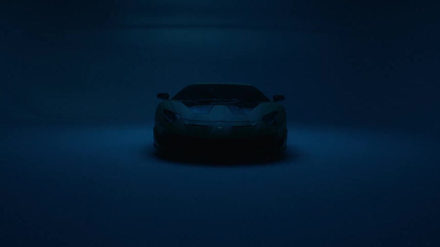 Blue light intermittently illuminates a parked sports car