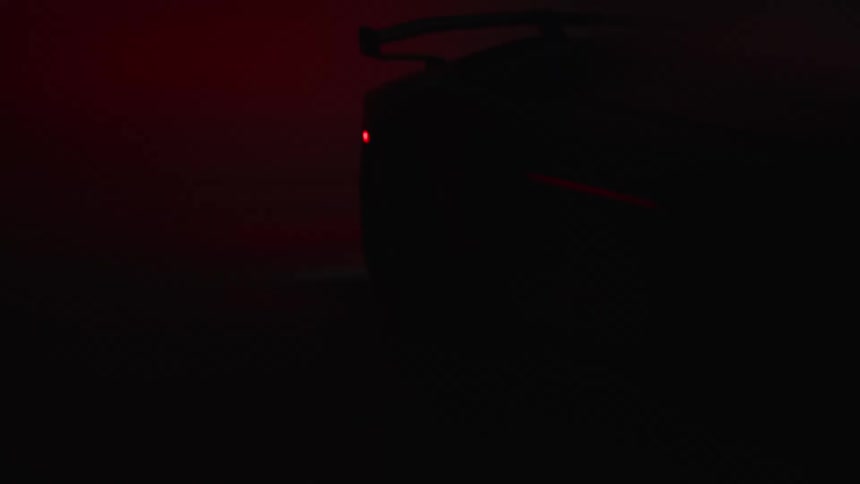 A highspeed sports car blurs across a bluelit studio emphasizing motion and sleek design