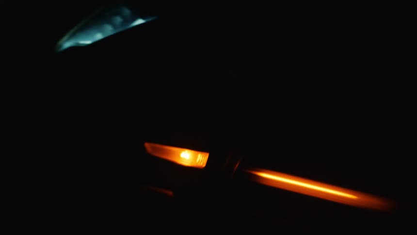 View of the front bumper headlights and hood of a sports car
