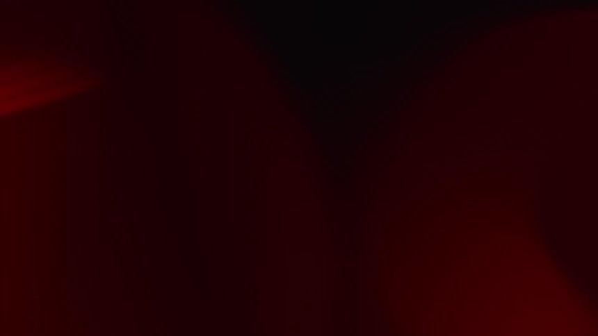Man is illuminated by red and blue light while sitting inside a lamborghini car