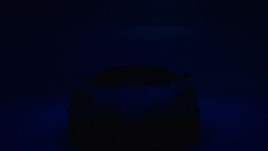 A dim blue light reveals a sports car in a dark garage