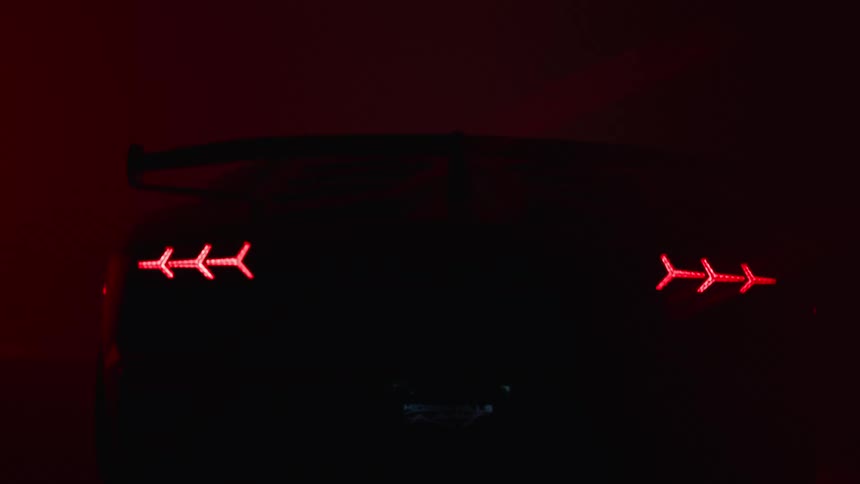 Lights are flickering on the parked sports car