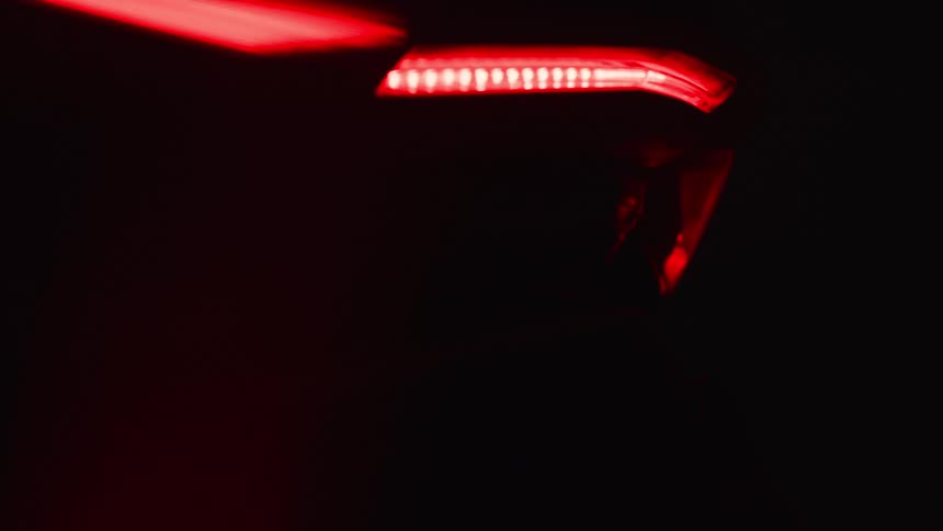 The taillight is on the parked car