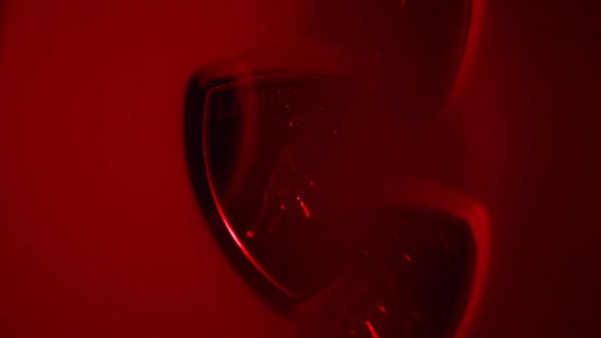 Multiple translucent lamborghini logos are super imposed on a more solid logo