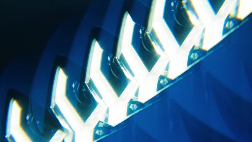 Closeup of the lit headlight of a lamborghini